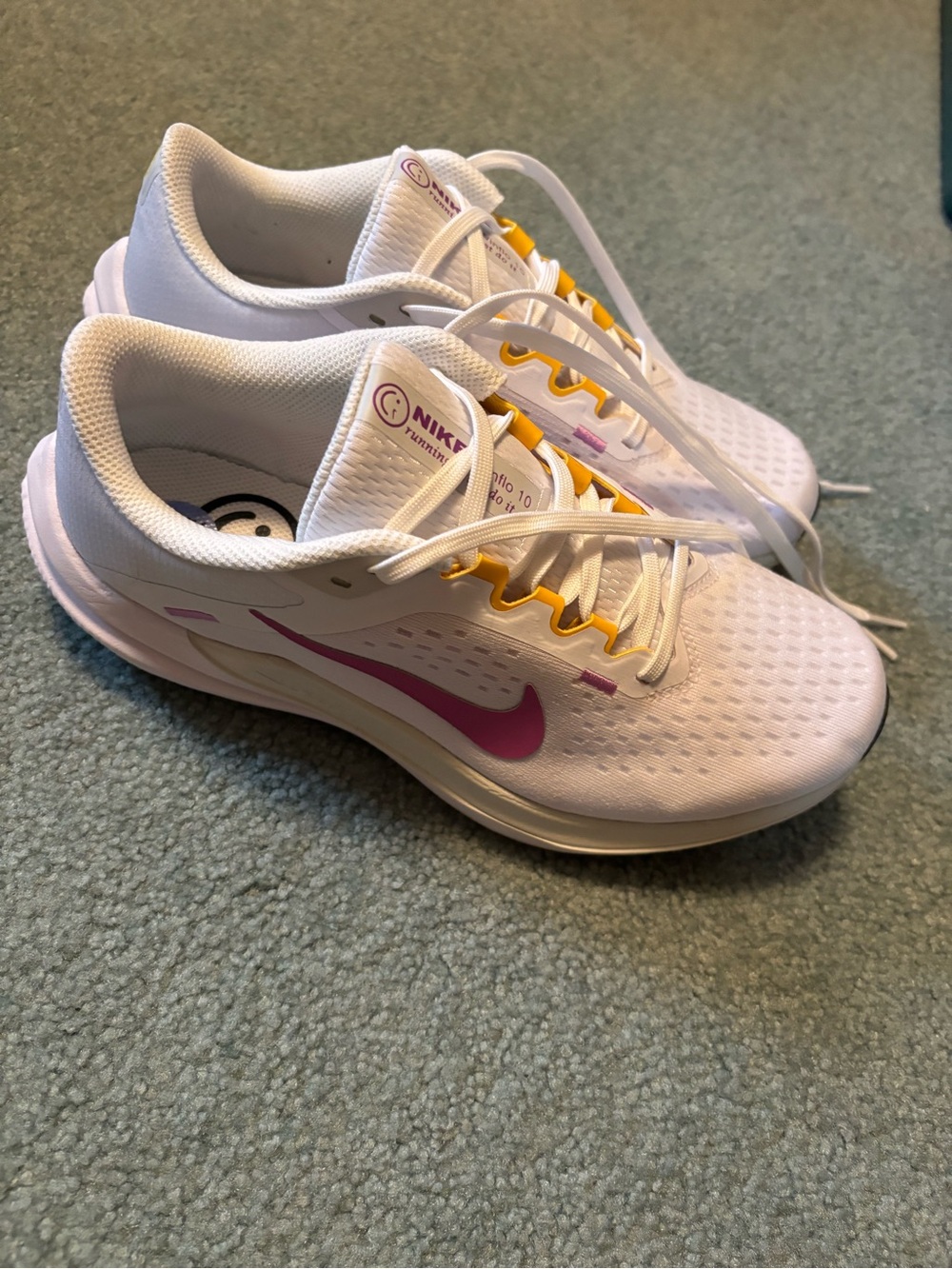 Nike Women’s White Running Shoes with Pink Swoosh and Yellow Accents
